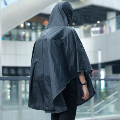 Man wearing Mark Ryden Infinity XL Rain usb charging business / travel backpack with rain cloak. 