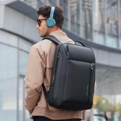 Cleverly designed expandable travel backpack with water-resistant Oxford material, YKK zippers, and multi-layered compartments. Suitable for 16" MacBook and 11" iPad, featuring USB charging, anti-theft pocket, wet-dry compartment, and lightweight at 1.2KG.