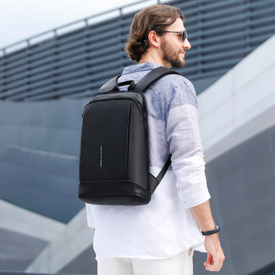 Man with Mark Ryden lightweight and waterproof USB charging backpack - Blend. 
