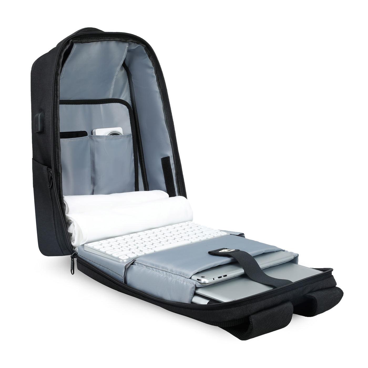 Open view of Mark Ryden Cache USB Charging backpack in black. 