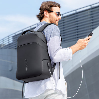 Man wearing Mark Ryden Limit anti-theft usb charging backpack. 